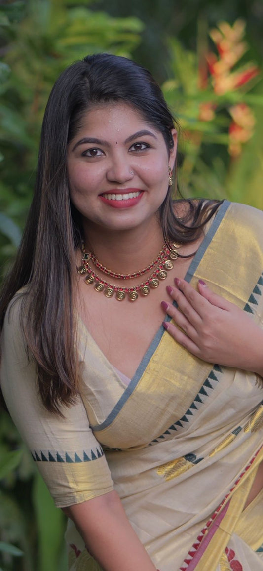 Lotus weave golden tissue saree with temple borders